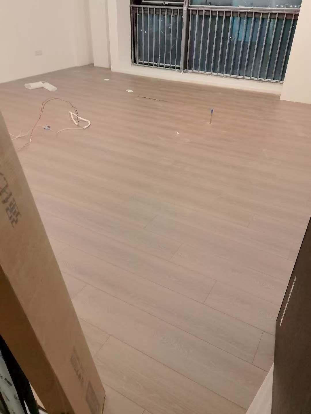 New three-layer solid wood flooring in latte color